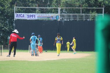 T20 CCL Delhi Selection Camp match on pitch with umpire and players