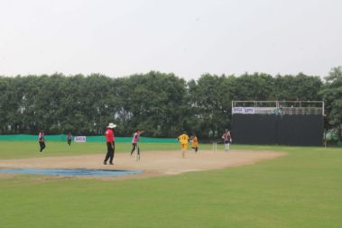 On-field cricket action with umpire overseeing Delhi Selection Camp