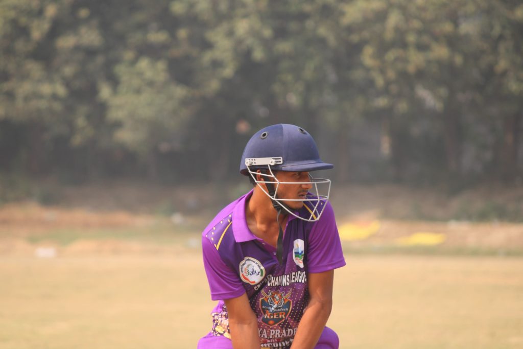 Player hitting straight drive