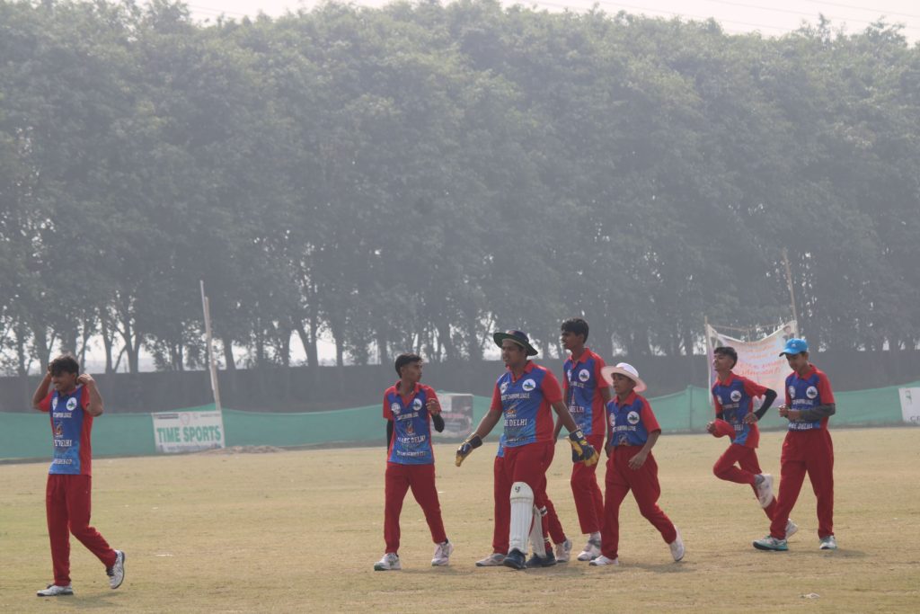 Team huddling before match