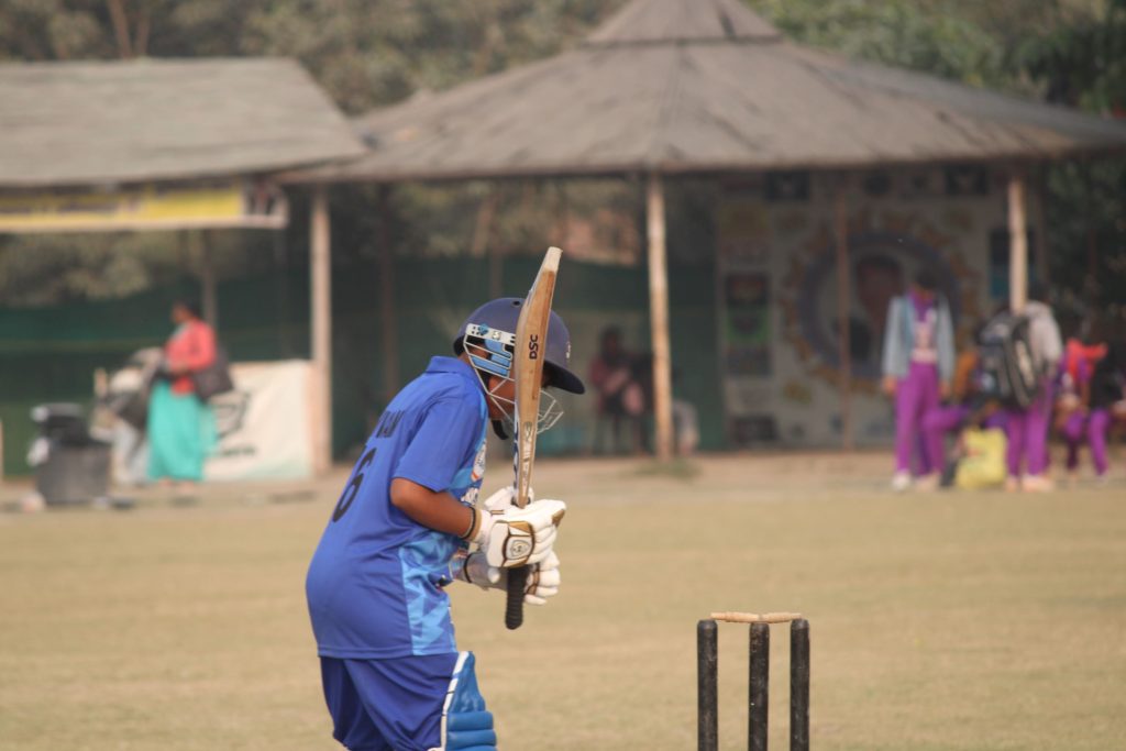 Batsman executing reverse sweep