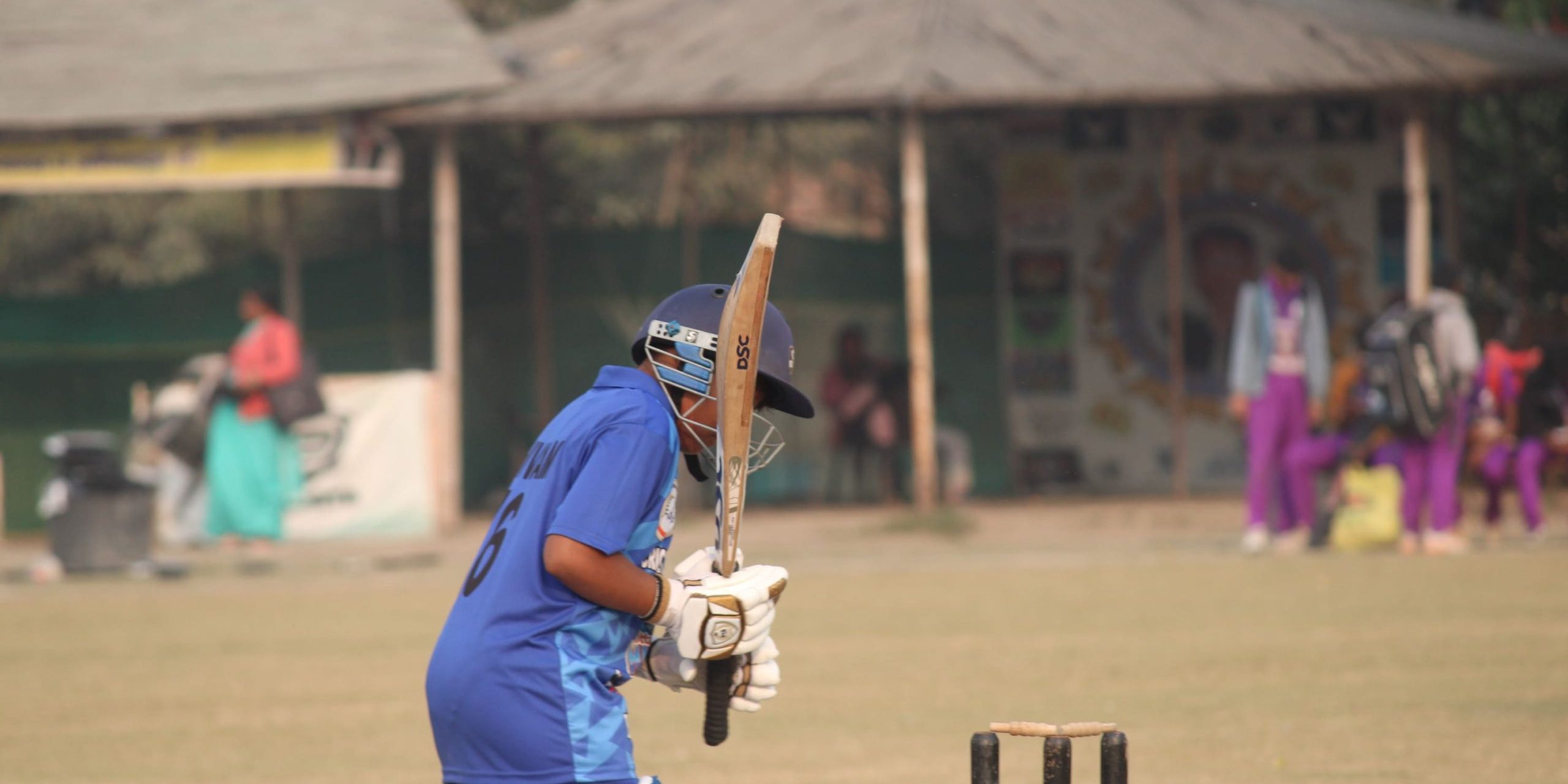 Batsman executing reverse sweep