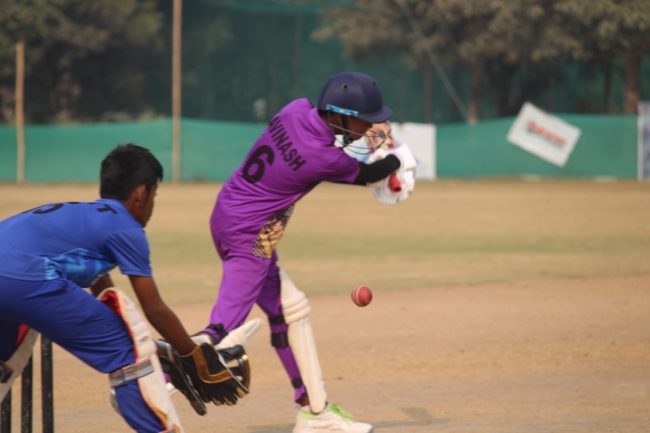 Batsman executing reverse sweep