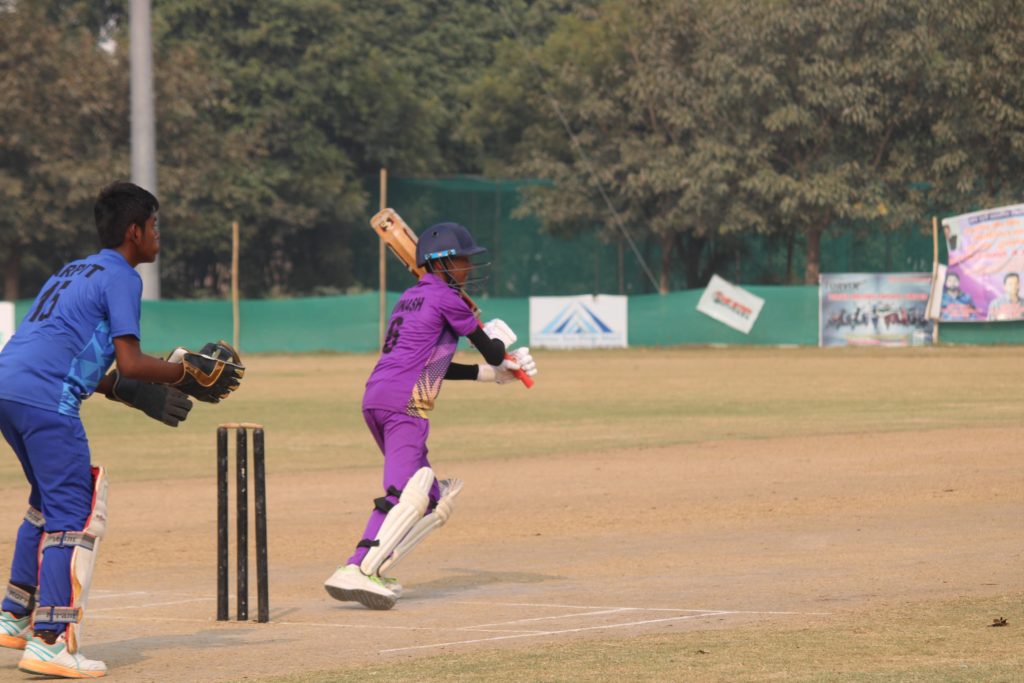 Batsman executing reverse sweep
