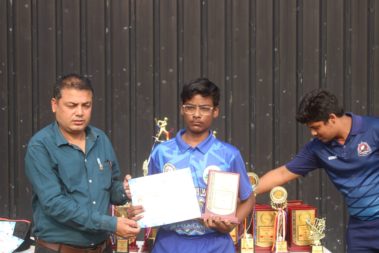 Young player showing certificate