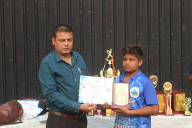 Young player showing certificate