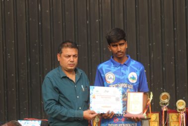 Young player showing certificate