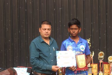 Young player showing certificate