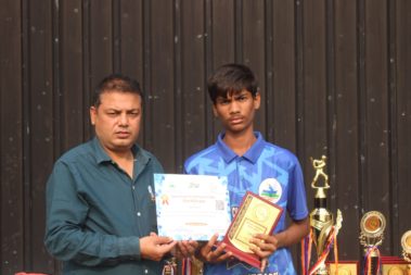 Young player showing certificate