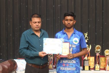 Young player showing certificate
