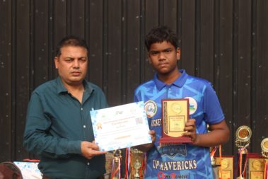 Young player showing certificate