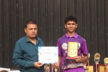 Young player showing certificate
