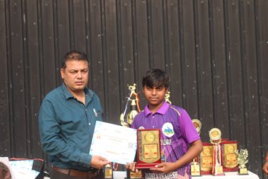 Young player showing certificate