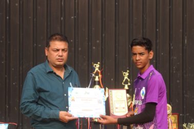 Young player showing certificate