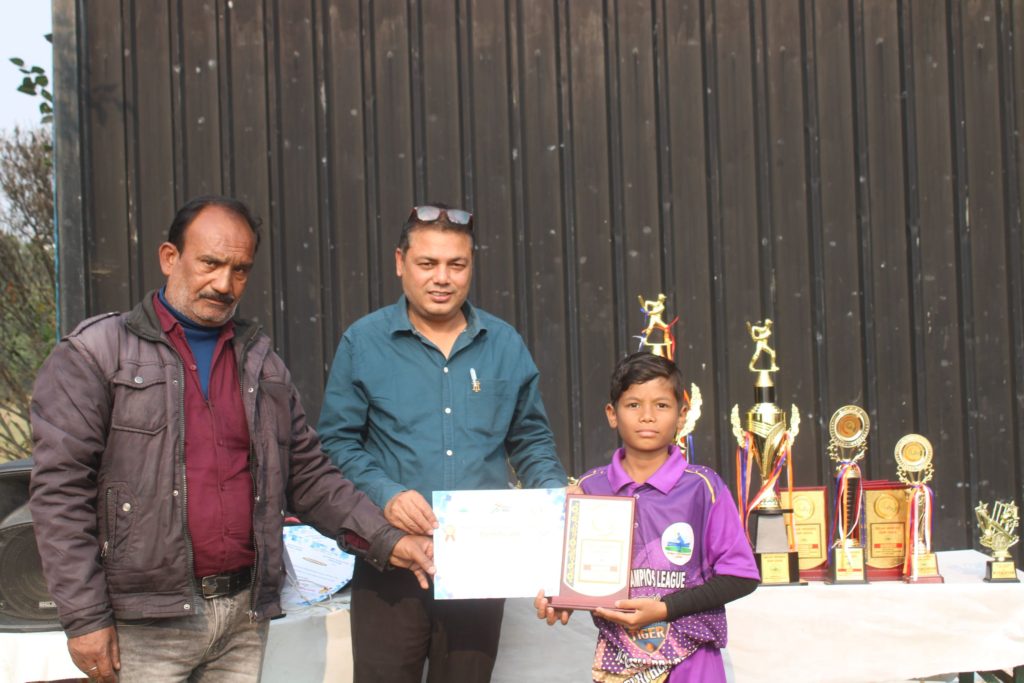 Young player showing certificate