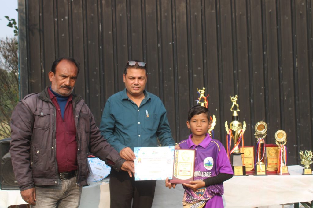 Young player showing certificate