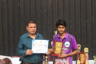 Young player showing certificate