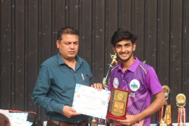 Young player showing certificate
