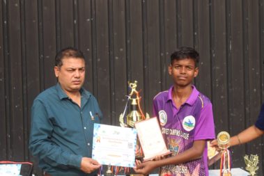 Young player showing certificate