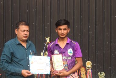 Young player showing certificate