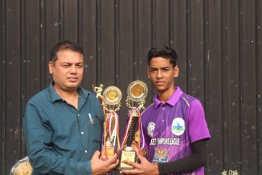 Captain holding golden trophy