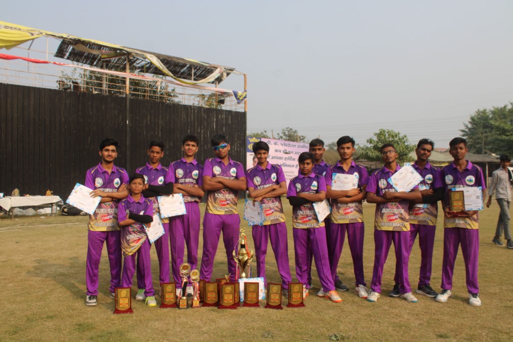 Team posing with trophy