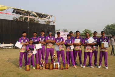Team posing with trophy