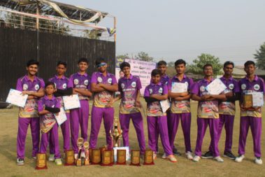 Team posing with trophy