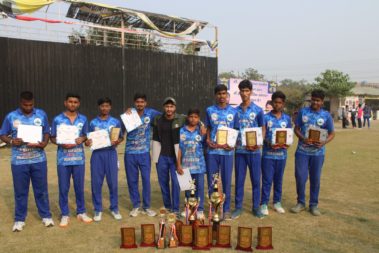 Team photo with trophy